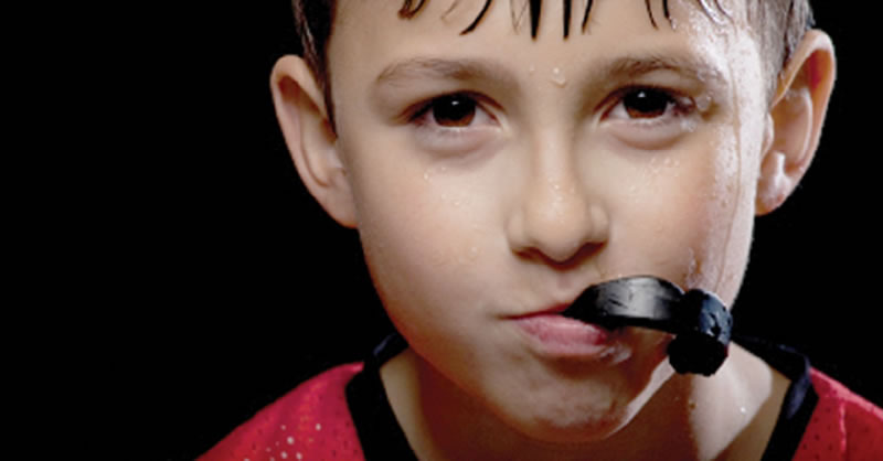 North York dentist - Mouth Guards - boy with sports guard after hockey practice