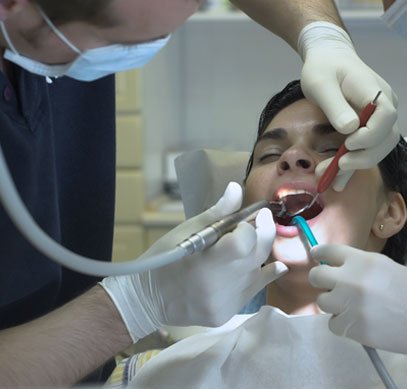 North York dentist providing dental treatment to a patient in a clinical setting